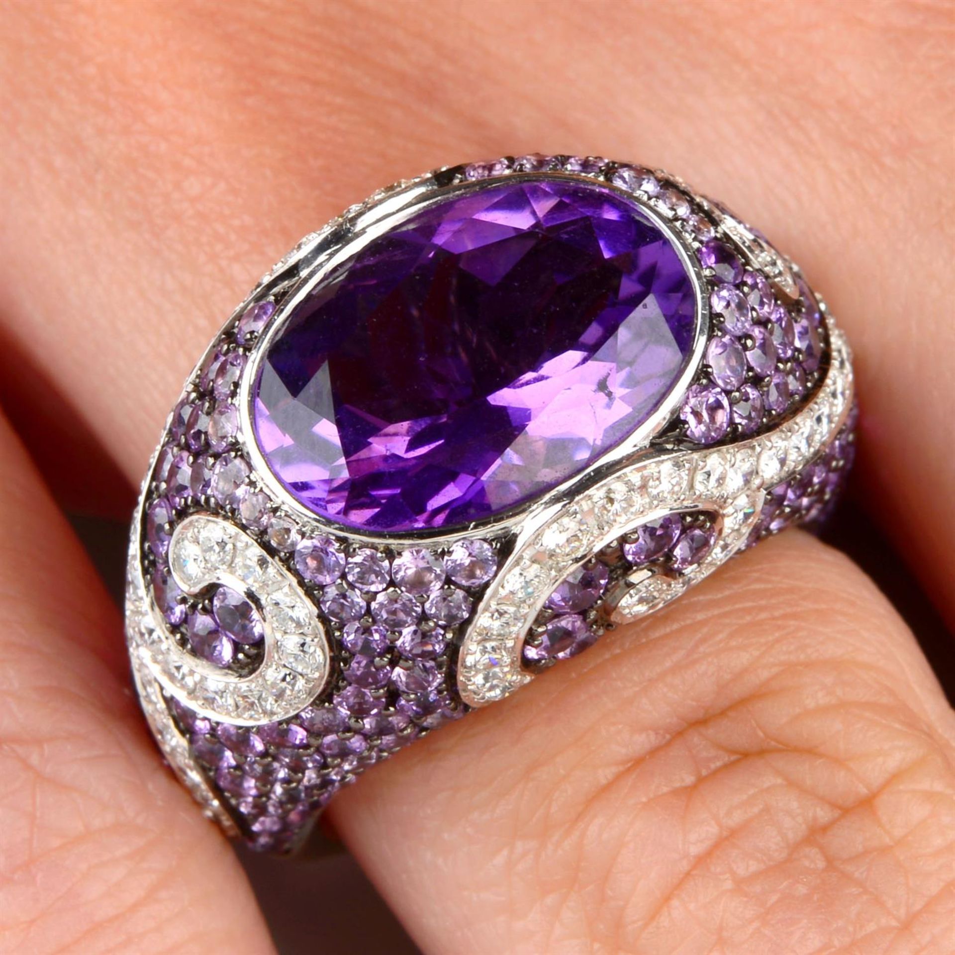 An amethyst, purple sapphire and brilliant-cut diamond dress ring.