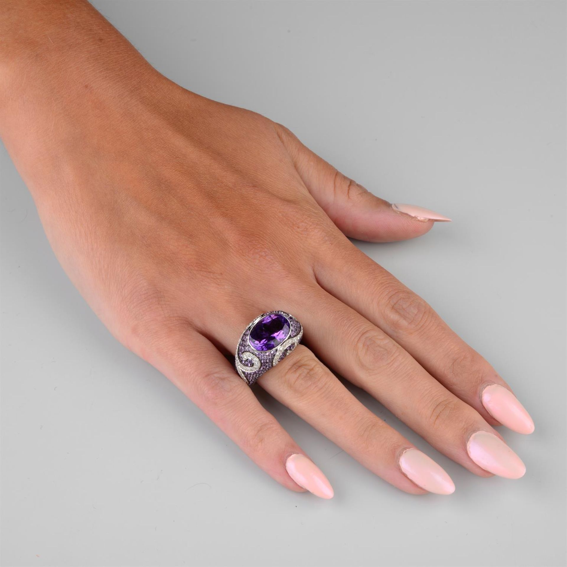 An amethyst, purple sapphire and brilliant-cut diamond dress ring. - Image 3 of 3