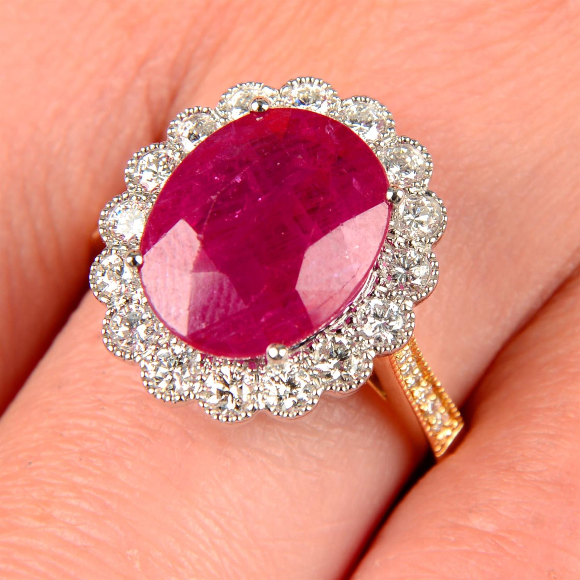 An 18ct gold ruby and diamond cluster ring.