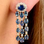 A pair of sapphire and diamond fringe earrings.