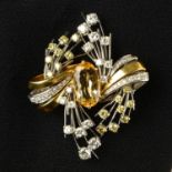 A yellow topaz, diamond and 'yellow' diamond bi-colour brooch.