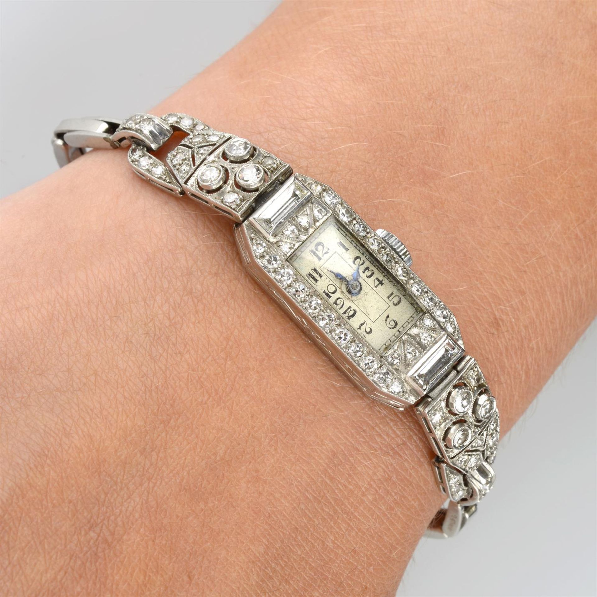 An Art Deco platinum vari-cut diamond watch.