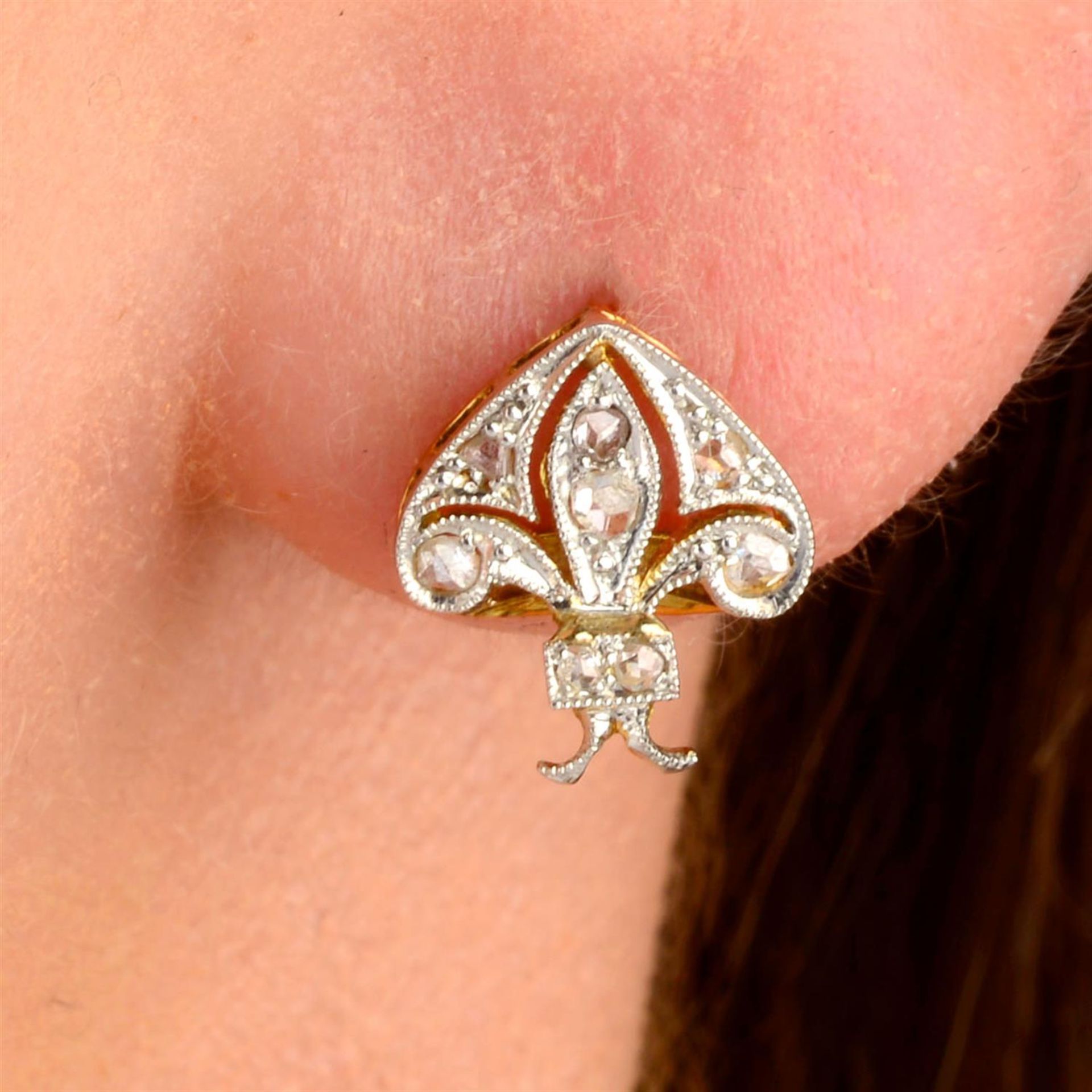 A pair of platinum and gold rose-cut diamond stylised insect earrings.