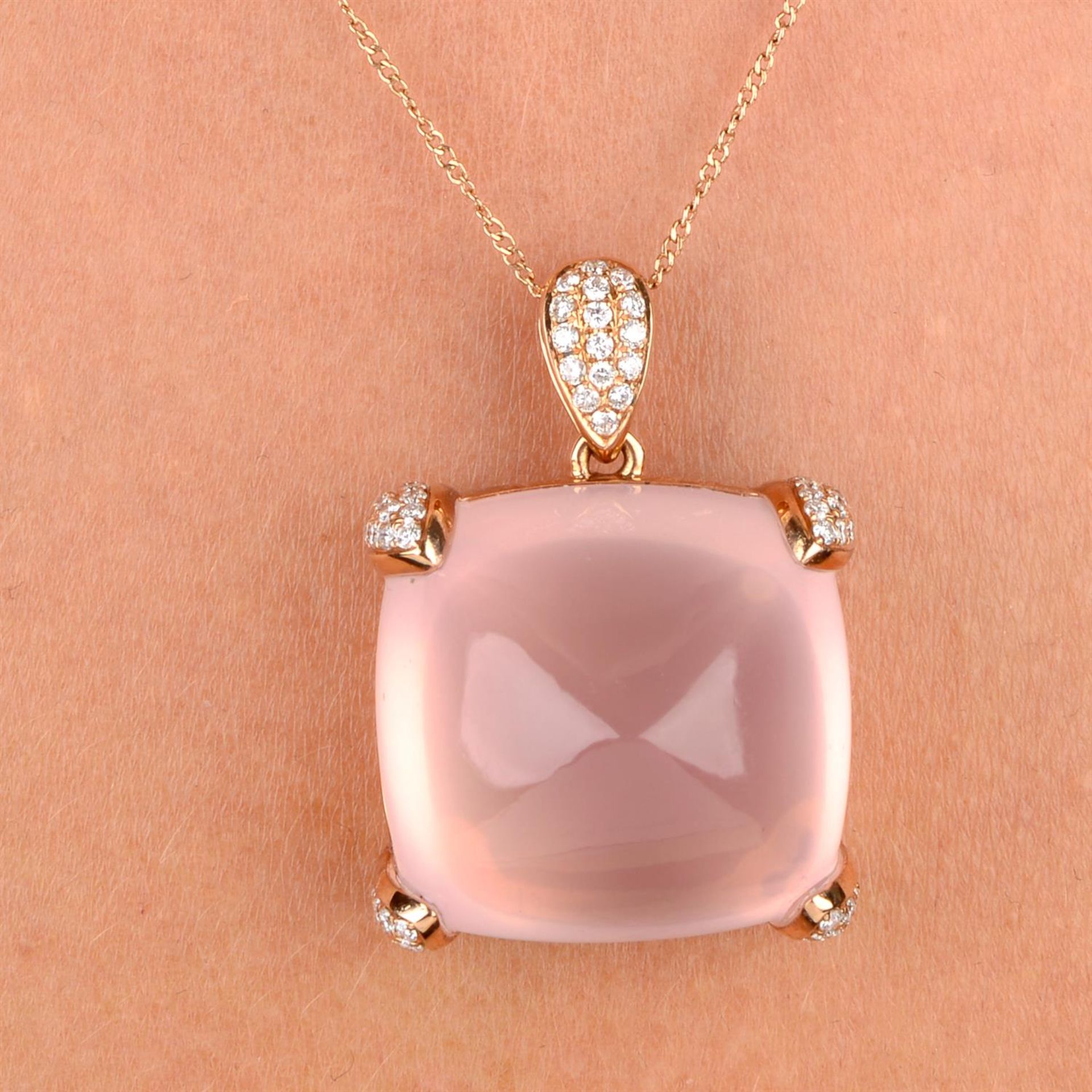 A rose quartz and pavé-set diamond pendant, with 18ct gold chain.