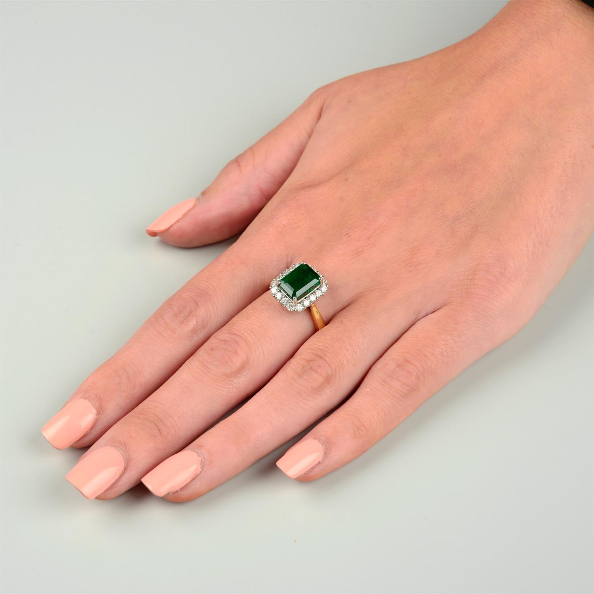 An 18ct gold emerald and brilliant-cut diamond cluster ring. - Image 5 of 5