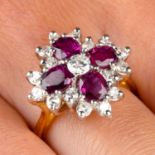 An 18ct gold ruby and vari-cut diamond cluster ring.