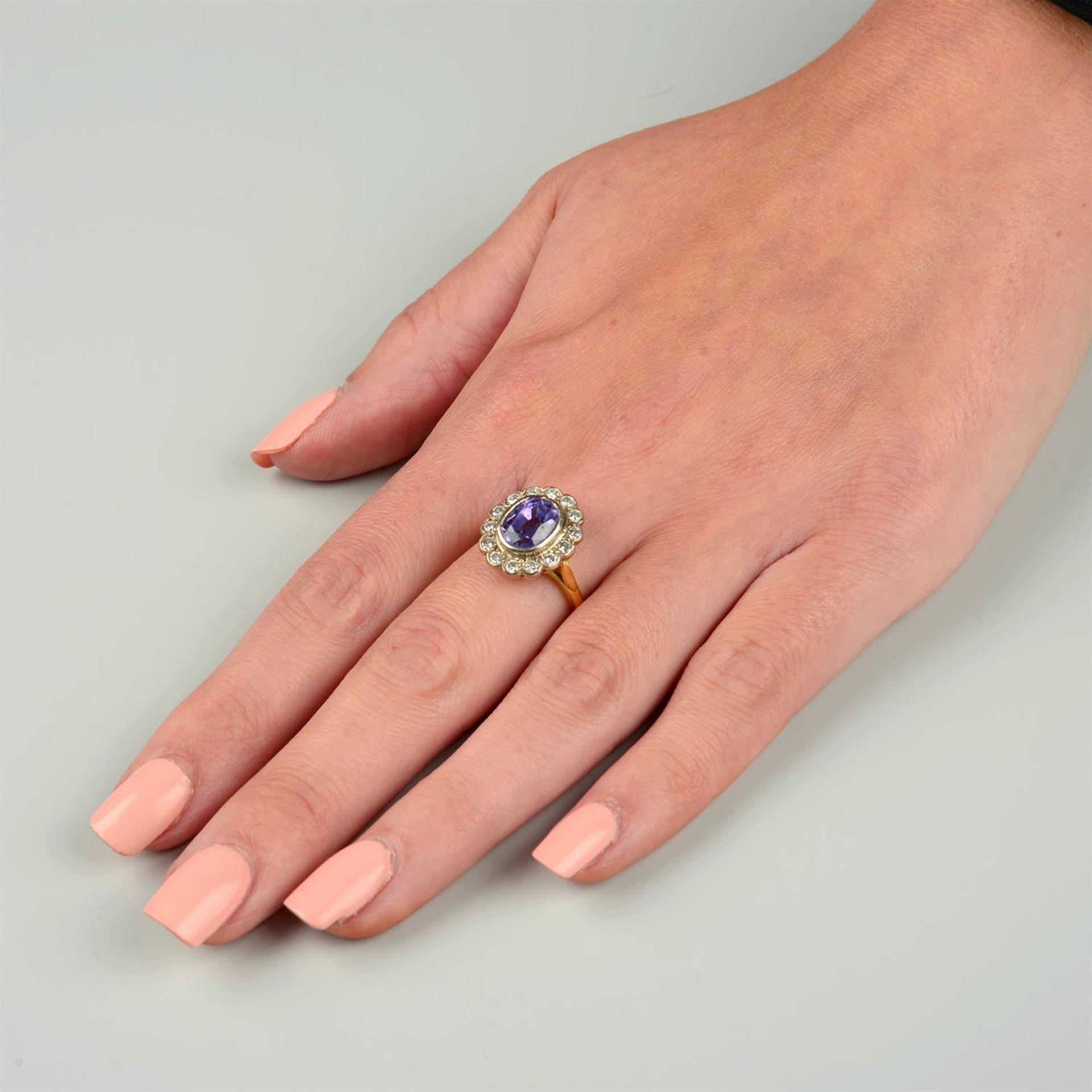 An 18ct gold Sri Lankan colour-change sapphire and brilliant-cut diamond cluster ring. - Image 5 of 5