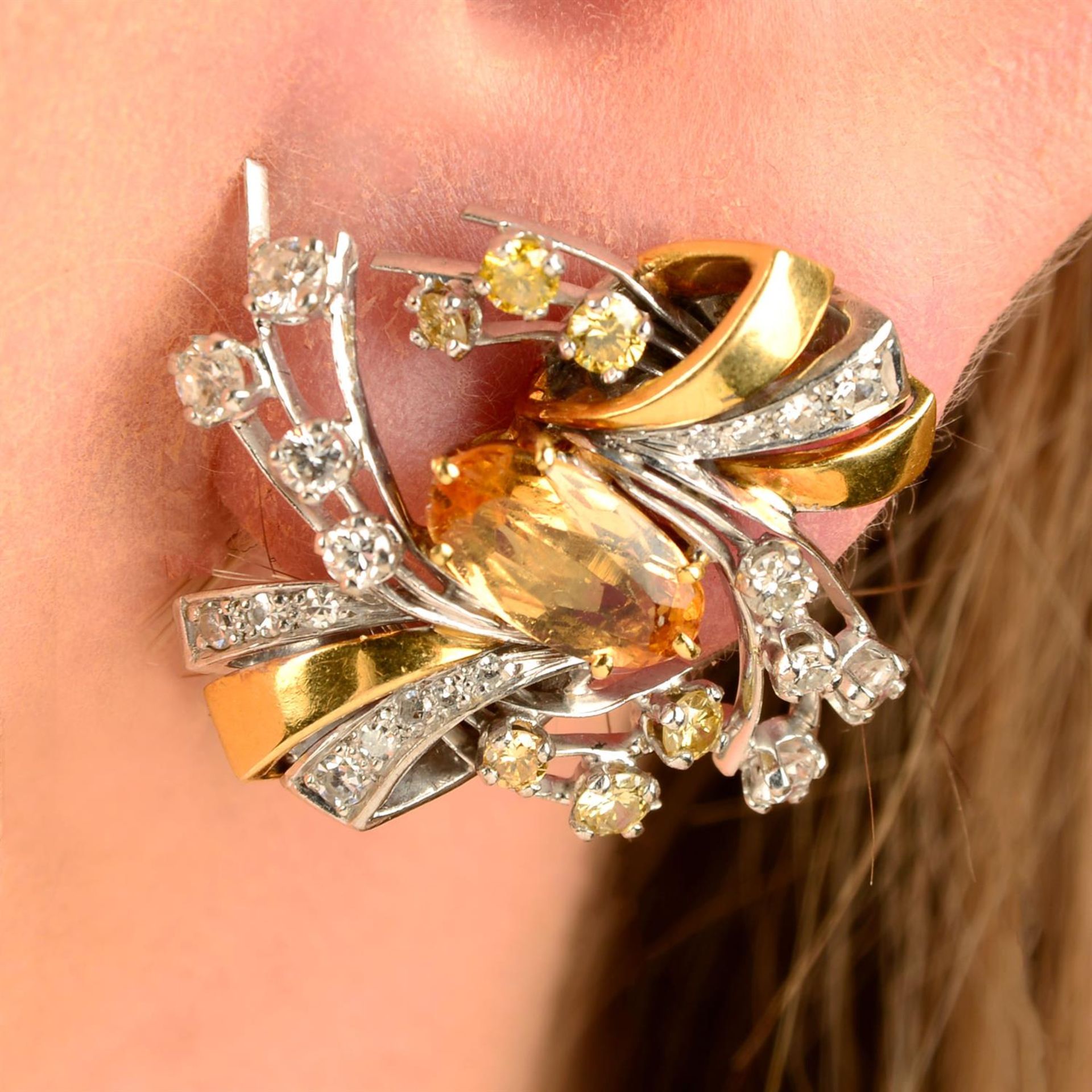A pair of yellow topaz, diamond and 'yellow' diamond bi-colour earrings.