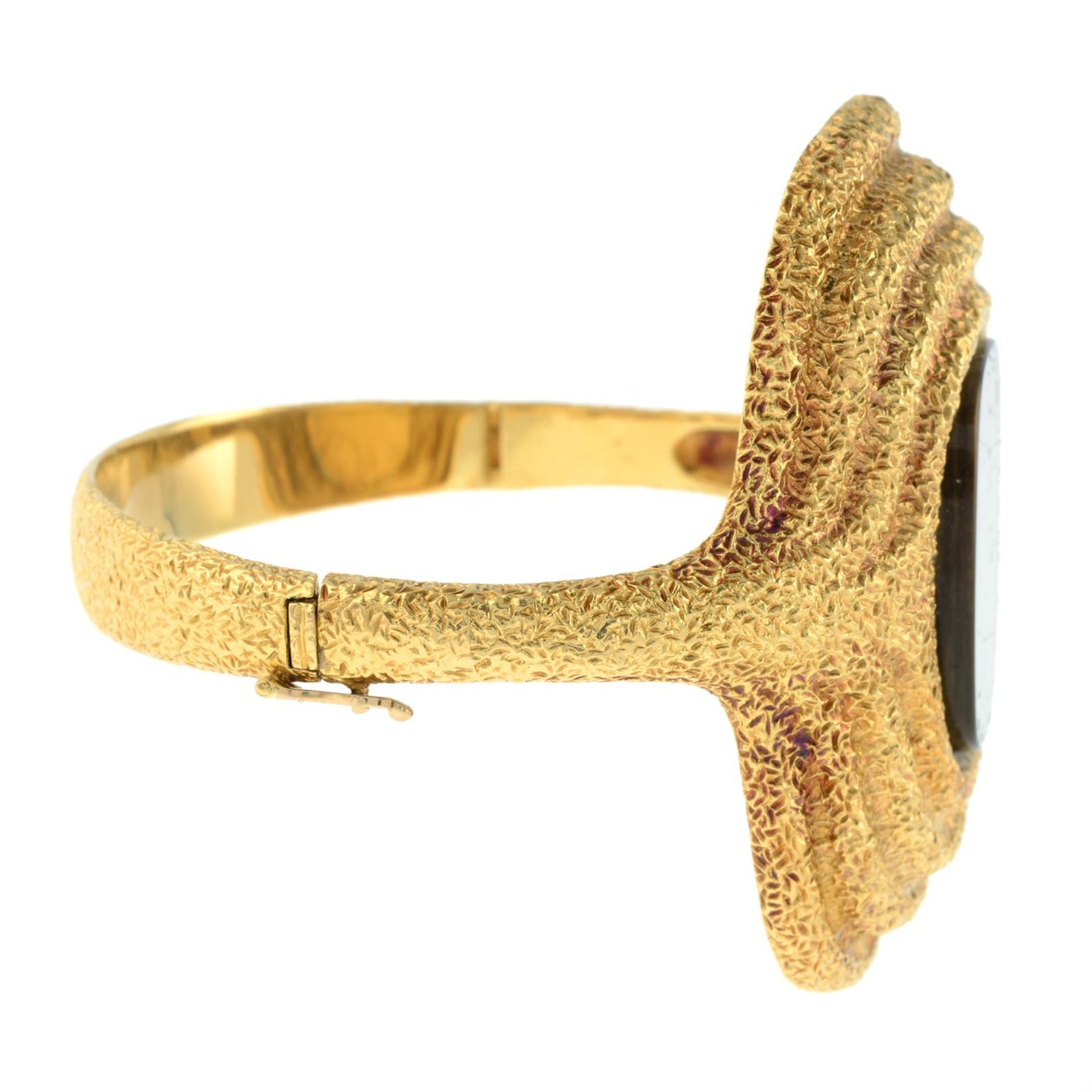 A 1970s 18ct gold watch bangle, with textured surrounds, by Chopard. - Image 4 of 4