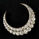 A Victorian silver and gold old-cut diamond two-row crescent moon brooch.