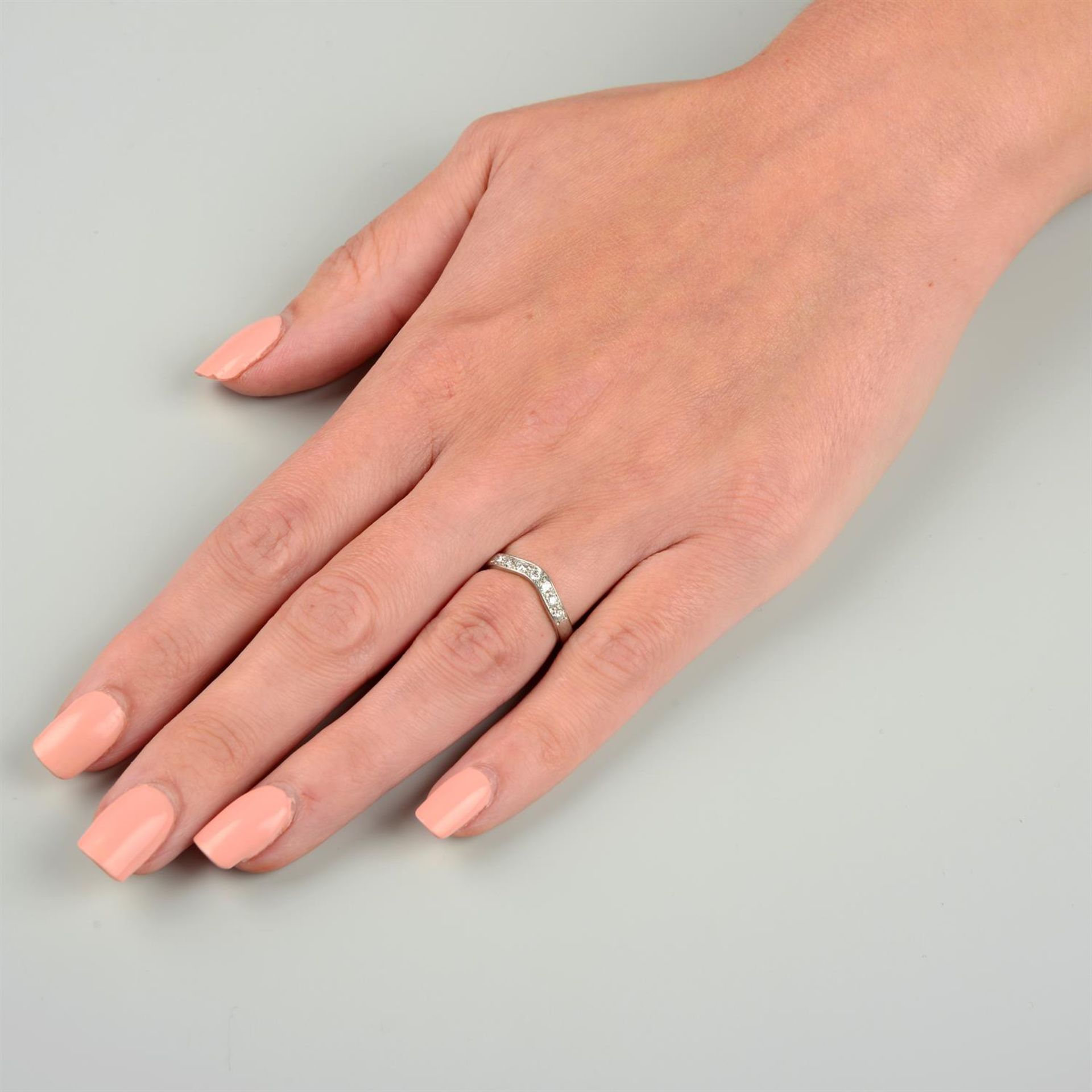 A platinum brilliant-cut diamond seven-stone shaped band ring. - Image 5 of 5