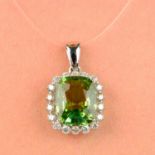 A green tourmaline and brilliant-cut diamond cluster pendant.
