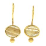 A pair of rutilated quartz single-stone earrings.