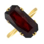 A garnet single-stone ring.