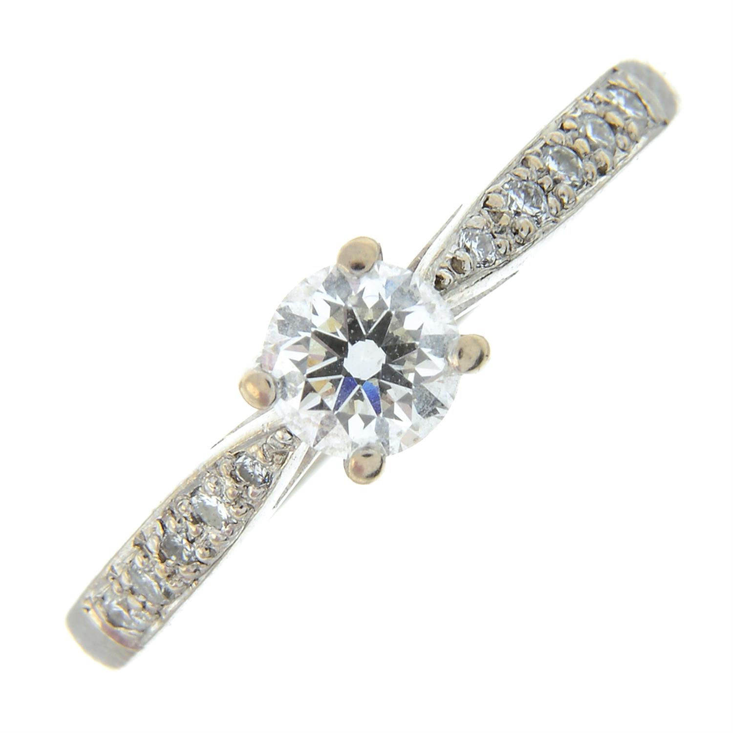 An 18ct gold diamond single-stone ring, with diamond line shoulders.