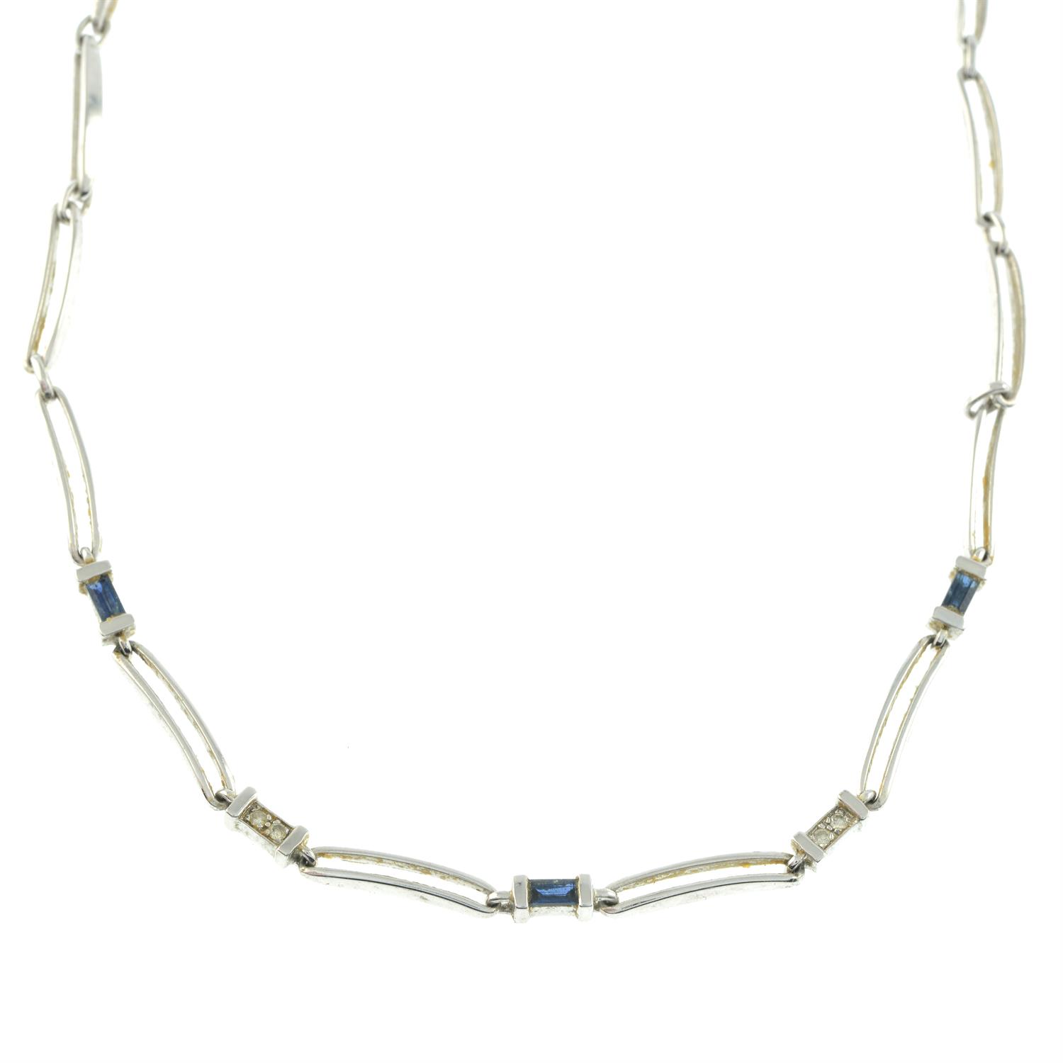 A 9ct gold polished link necklace, with diamond and blue gem spacers.