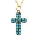 A turquoise cross pendant, with trace-link chain.
