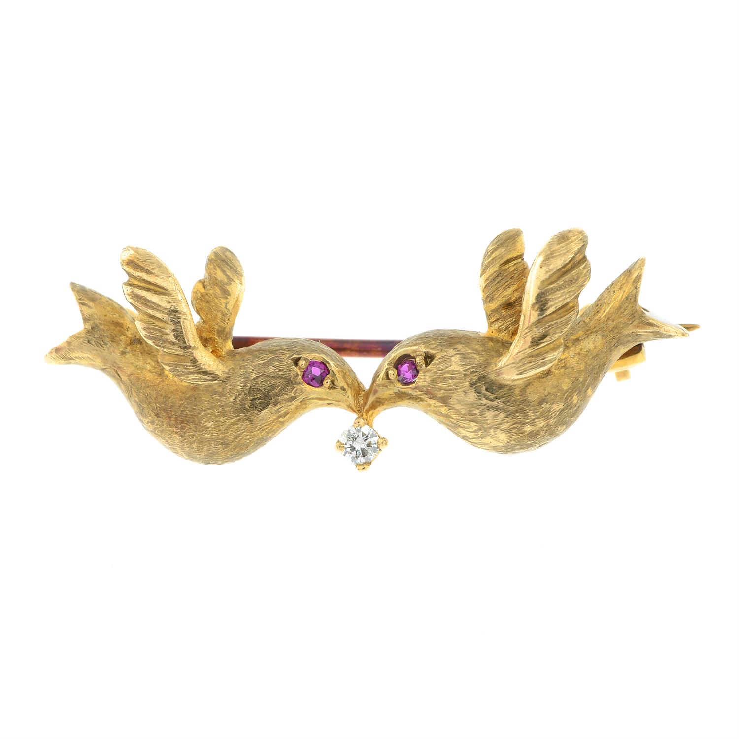 A 9ct gold dove duo brooch, with ruby and diamond highlights.