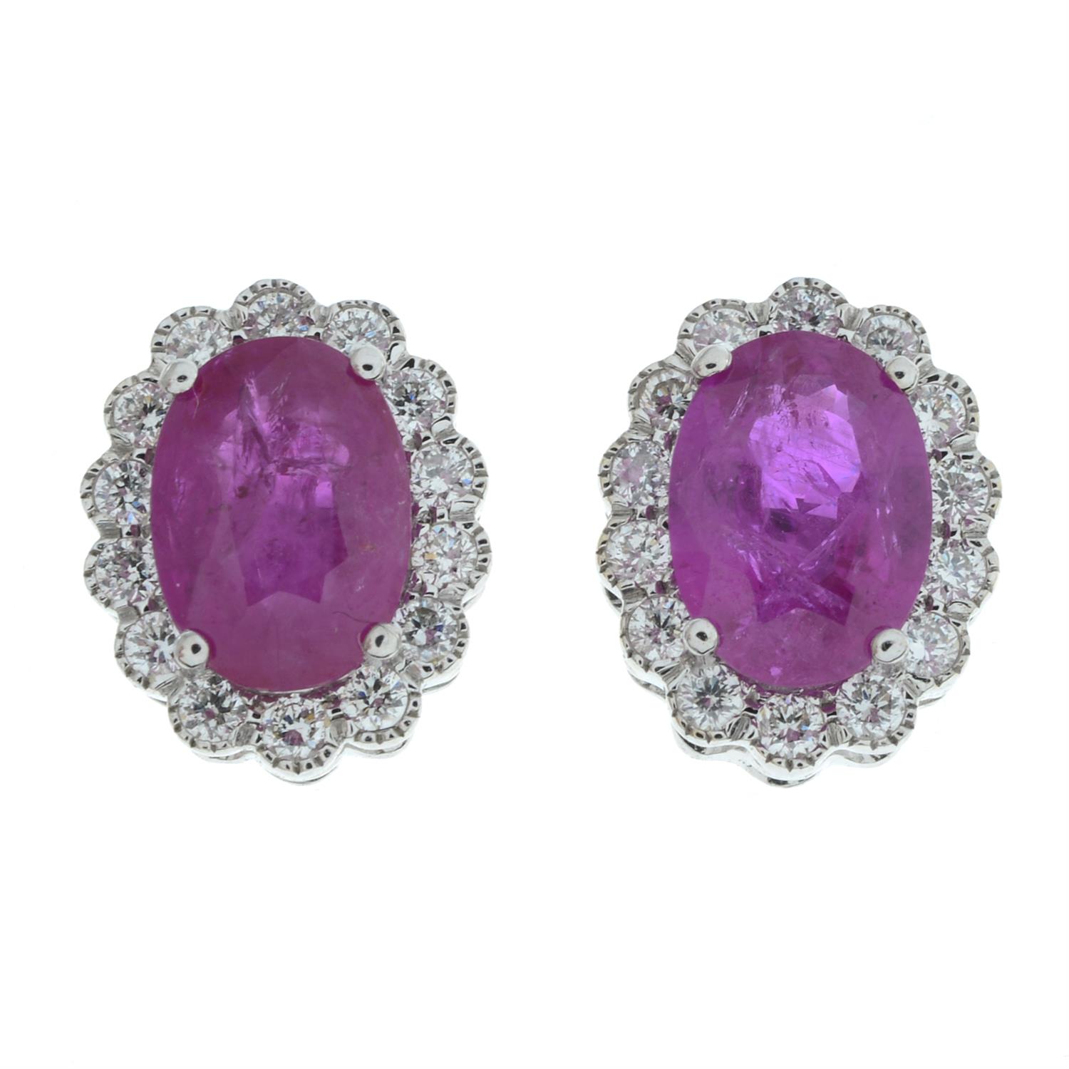 A pair of 18ct gold ruby and diamond cluster earrings.