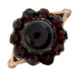 A garnet cluster ring.