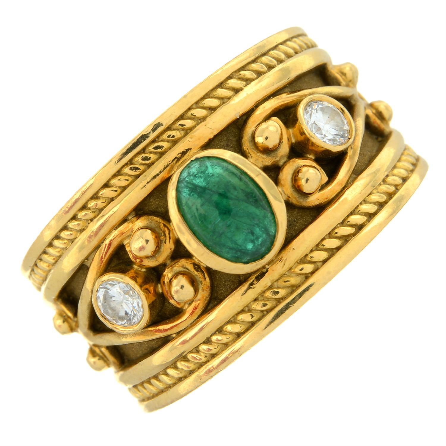 An 18ct gold emerald and brilliant-cut diamond three-stone band ring.