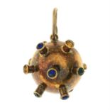 A mid 20th century gold paste naval mine pendant. AF.