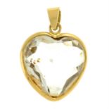 A carved rock crystal heart pendant.