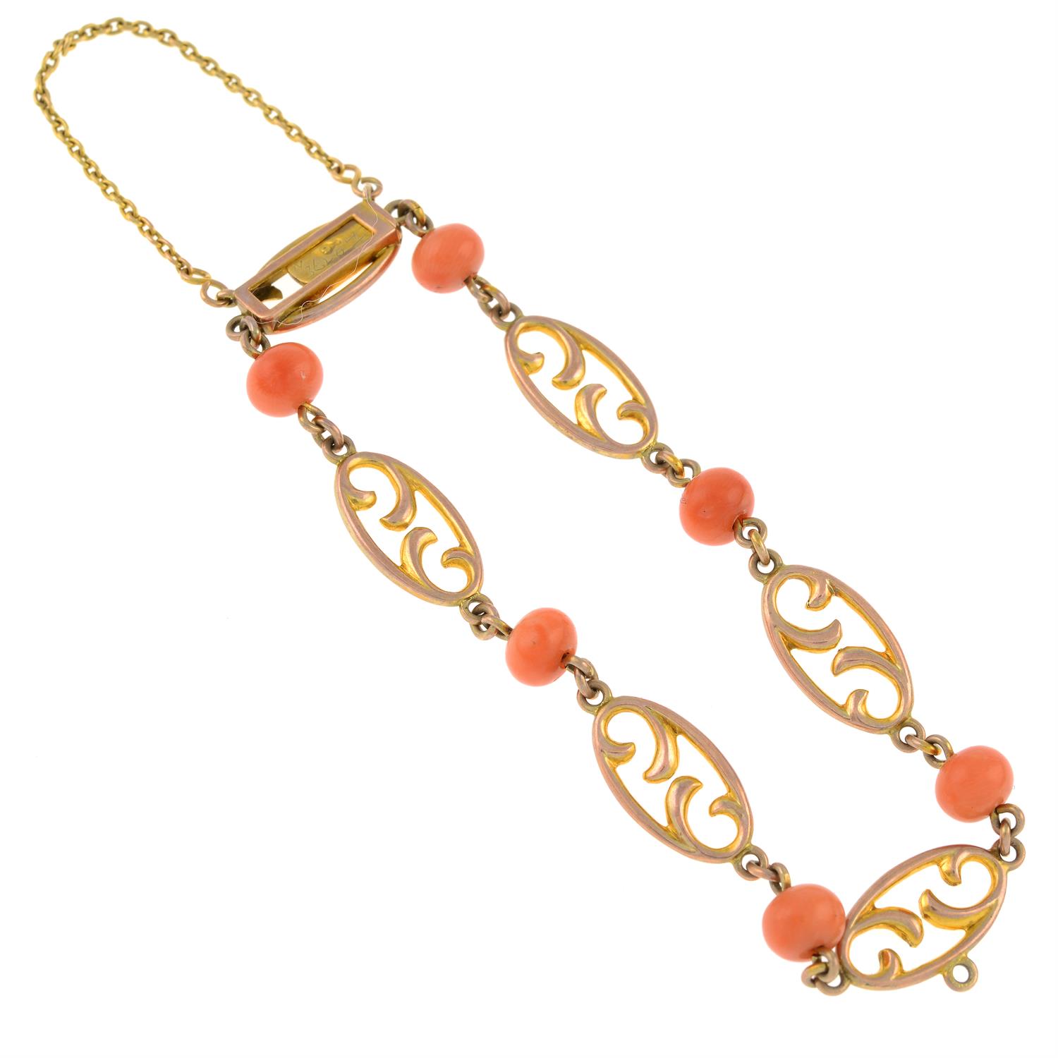 An early 20th century 9ct gold openwork link bracelet, with coral spacers. - Image 2 of 2