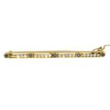 A sapphire and seed pearl bar brooch.