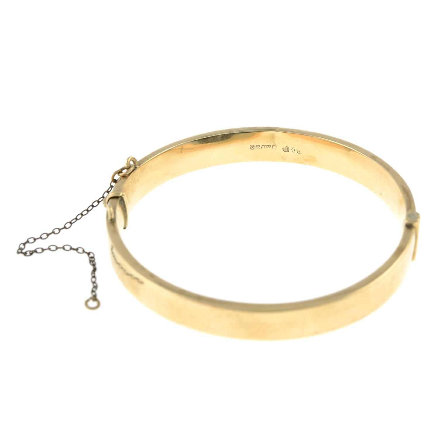 A 9ct gold scroll engrave hinged bangle, by Smith & Pepper. - Image 2 of 2