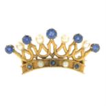 A sapphire and seed pearl crown brooch.