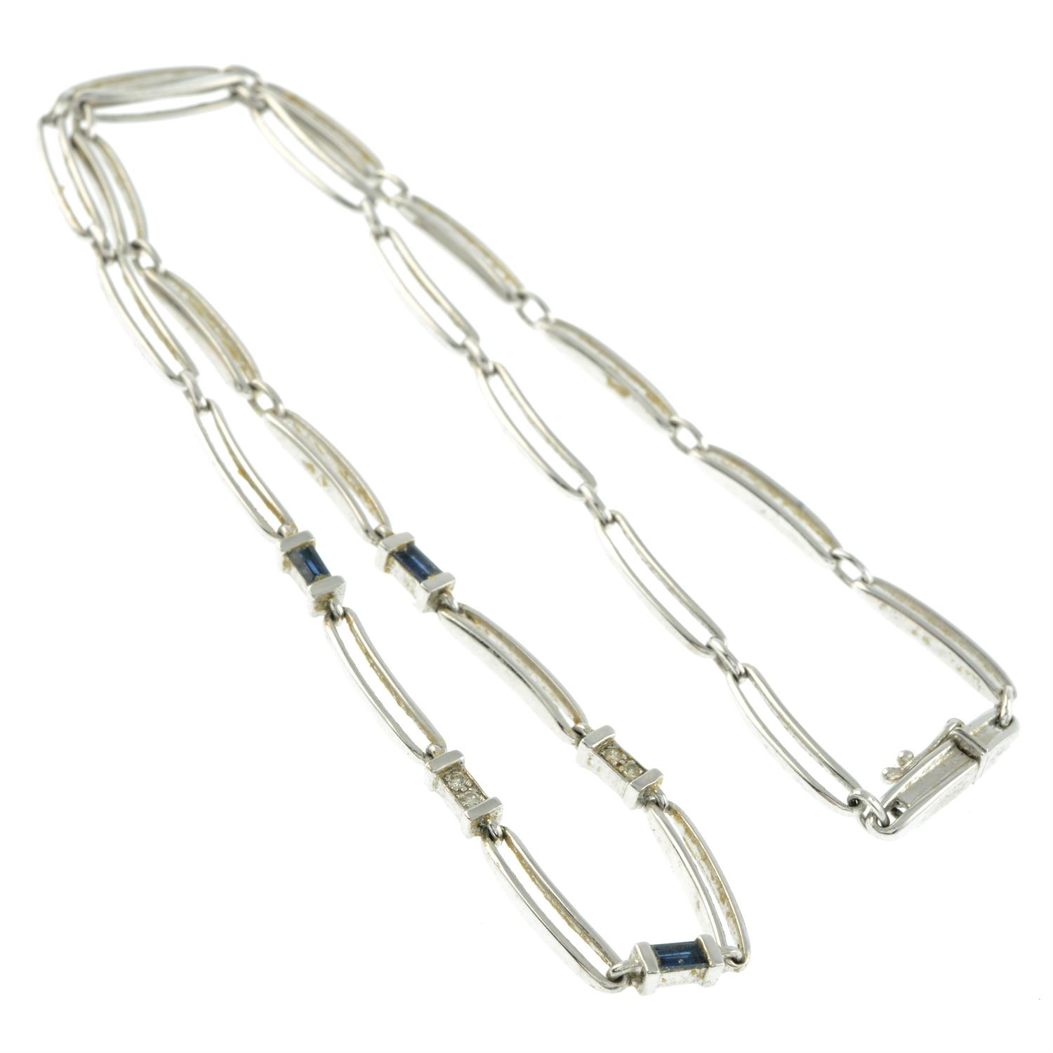 A 9ct gold polished link necklace, with diamond and blue gem spacers. - Image 2 of 2