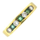 An emerald and colourless gem half eternity ring.