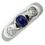 A platinum sapphire and old-cut diamond three-stone band ring.