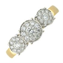 An 18ct gold diamond triple cluster ring.