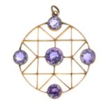 An early 20th century gold geometric openwork pendant, with amethyst highlights.
