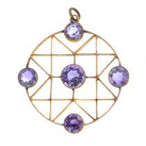 An early 20th century gold geometric openwork pendant, with amethyst highlights.