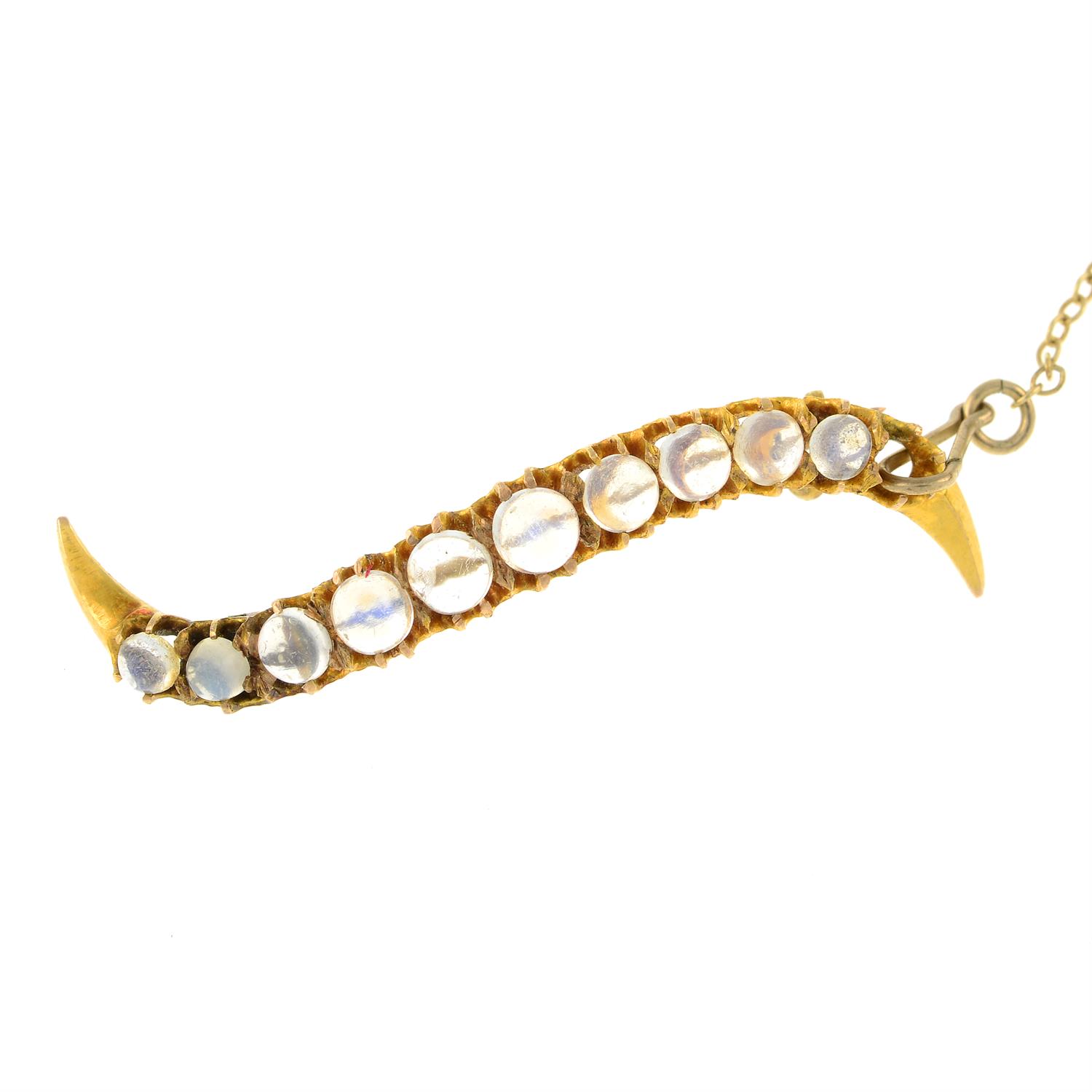 Edwardian gold moonstone undulating line brooch