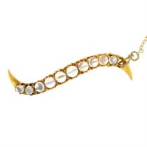 Edwardian gold moonstone undulating line brooch