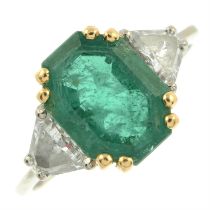 Cushion-cut emerald and triangular-shape diamond three-stone ring.