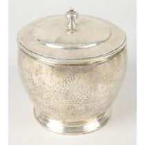 A 1920's planished silver lidded jar.