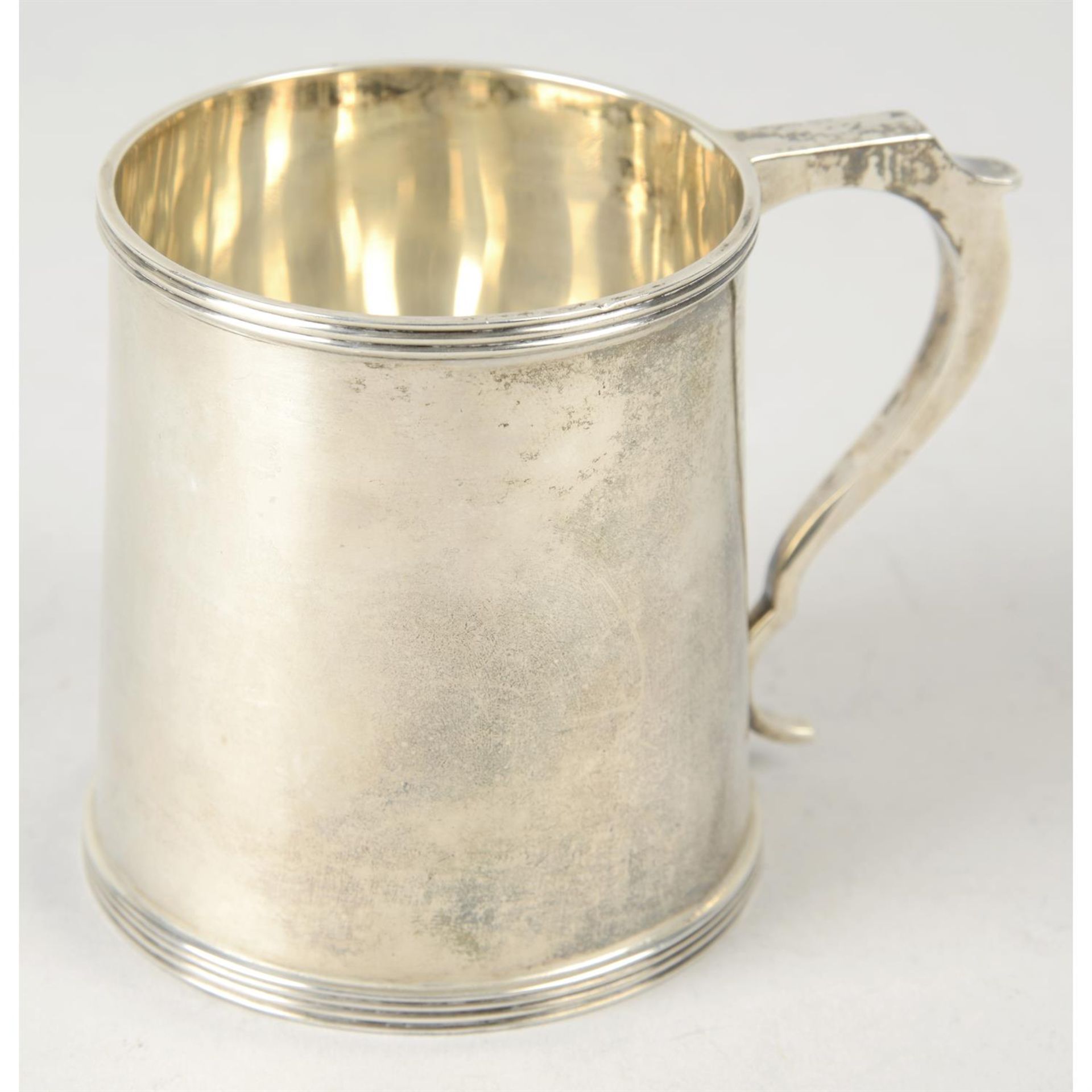 A George V plain silver christening mug.