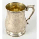 A George II silver mug.