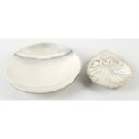 An Edwardian silver shell dish; together with a 1920's silver shallow dish. (2).