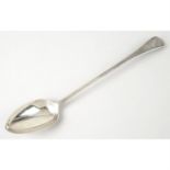 A George III silver basting spoon in Old English pattern.