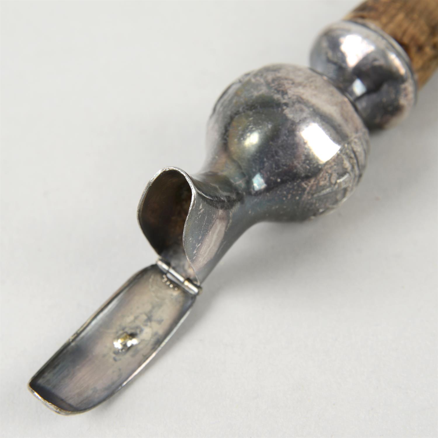 A modern silver mounted bottle pourer; together with an unmarked example. (2). - Image 3 of 3