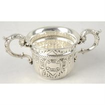 An Edwardian silver porringer.