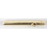 A 9ct gold push button action telescopic propelling pencil.