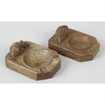 A Mouseman wooden ashtray, together with a similar example. (2)