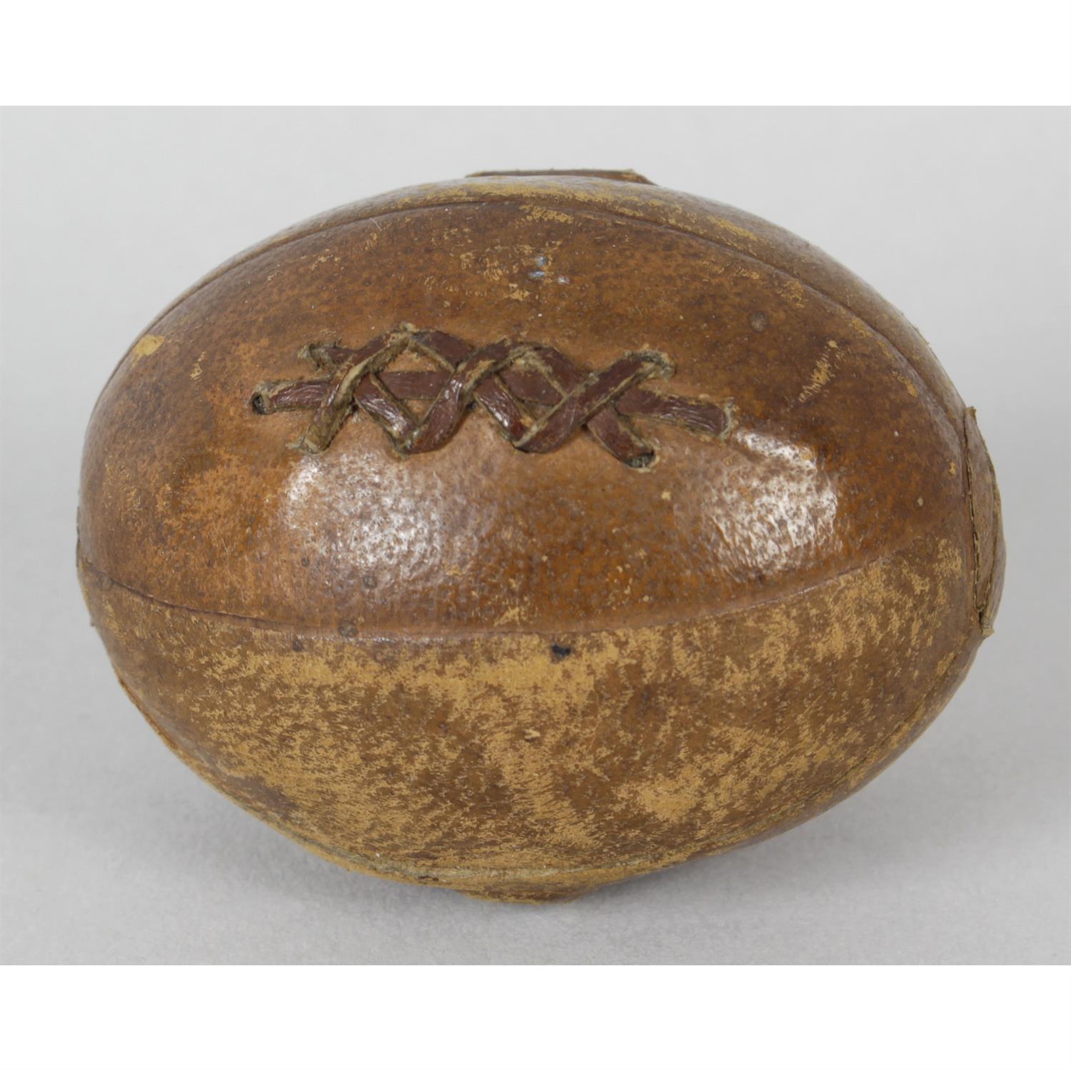 A novelty 'rugby ball' travelling inkwell.